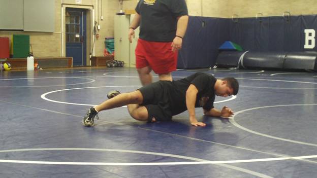 C:\Users\John\Desktop\Hewlett Wrestling Strength\pics\Wrestling Training Tip How to Prevent Soreness SMR Lower Body with Lax Ball Frame - 1549.jpg
