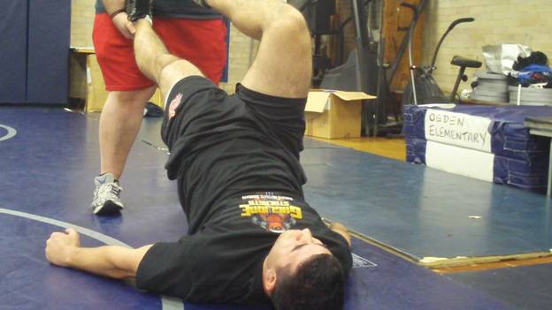 C:\Users\John\Desktop\Hewlett Wrestling Strength\pics\Wrestling Injury Prevention Partner Glute Bridge Series Frame - 1321.jpg