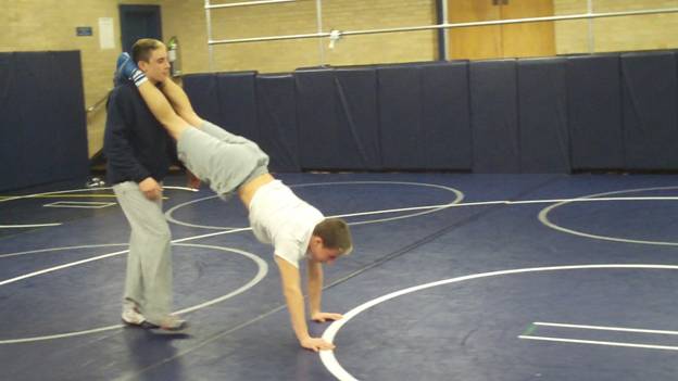 C:\Users\John\Desktop\Hewlett Wrestling Strength\pics\Wrestling Training Tips How to  Improve you Top game and leg riding ability with partner wheel barrow walks Frame - 1154.jpg