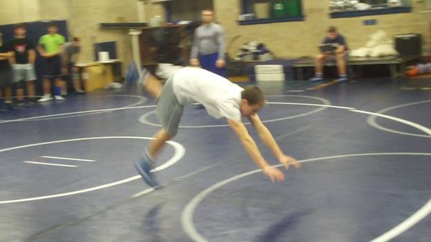 C:\Users\John\Desktop\Hewlett Wrestling Strength\pics\Wrestling Training Tips How to  Improve your  scrambles with Gymnastics Roll series Frame - 289.jpg
