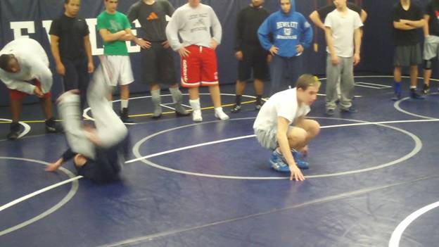C:\Users\John\Desktop\Hewlett Wrestling Strength\pics\Wrestling Training Tips How to  Improve your  scrambles with Gymnastics Roll series Frame - 49.jpg