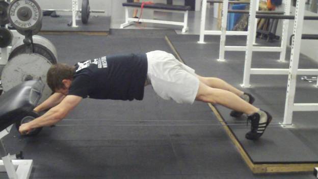 C:\Users\John\Desktop\Wrestling Strength videos\wrestler-power series\Wrestler-Power Series #2 Standing Ab Wheel Rollouts to strengthen your core Frame - 2713.jpg